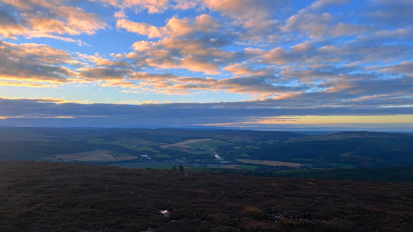 Rothes below the hill, the distillery steam rising, the Firth beyond