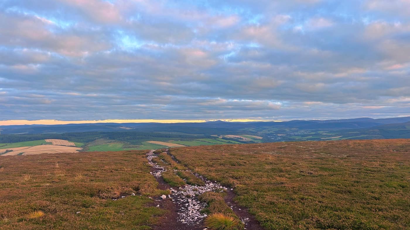 The stony summit path through the heather, Ben Rinnes on the skyline