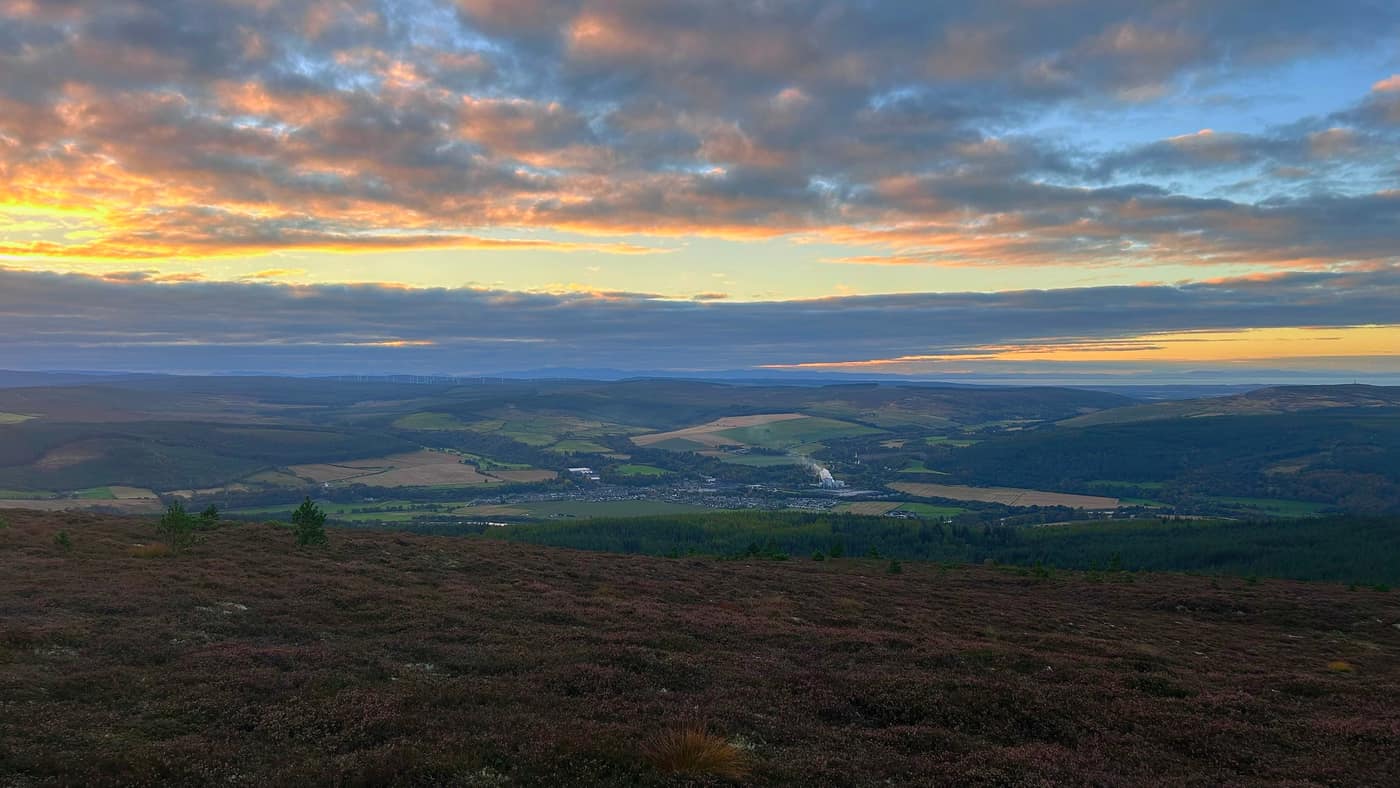 The sunset over Rothes and the valley from the top