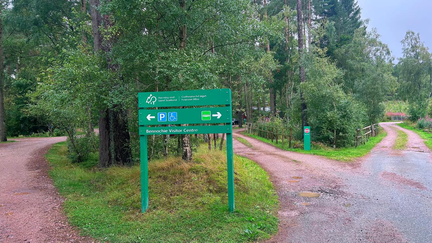 The green Forestry and Land Scotland sign at the fork, pointing to the Bennachie Visitor Centre