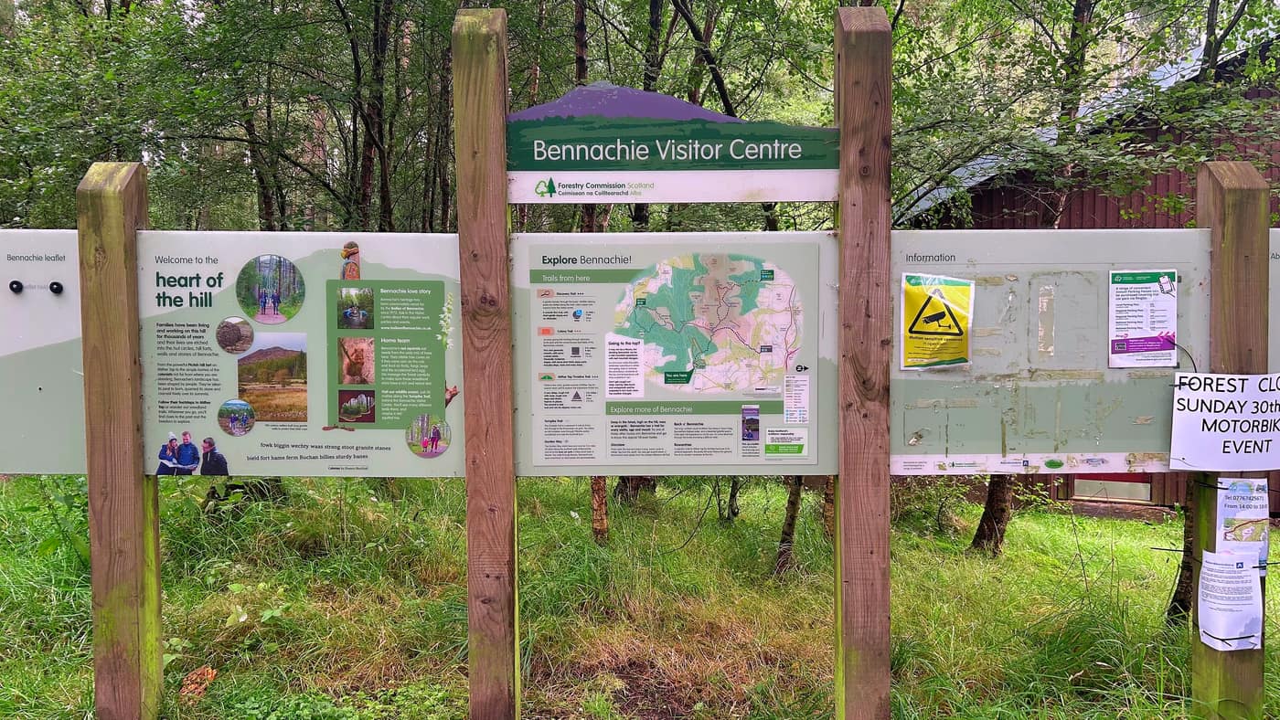 The Bennachie Visitor Centre information board, with the trail map and the walk options on it