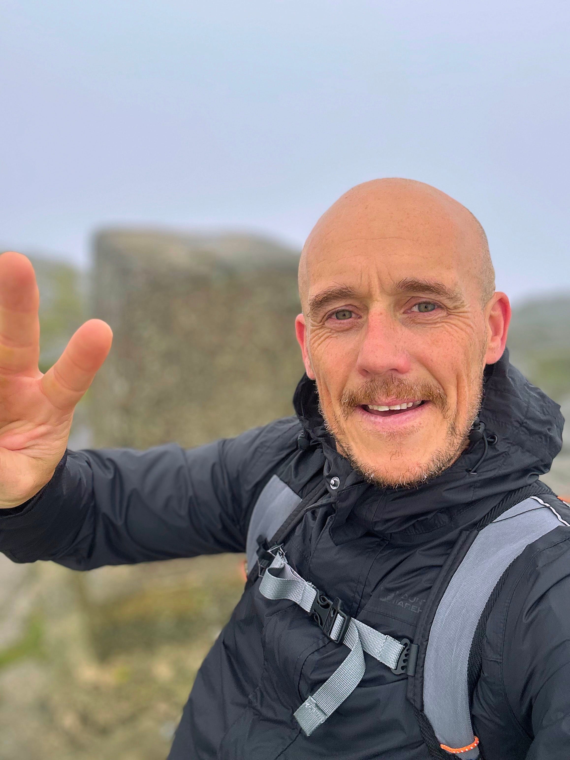Me at the trig point on Mither Tap, mist behind
me
