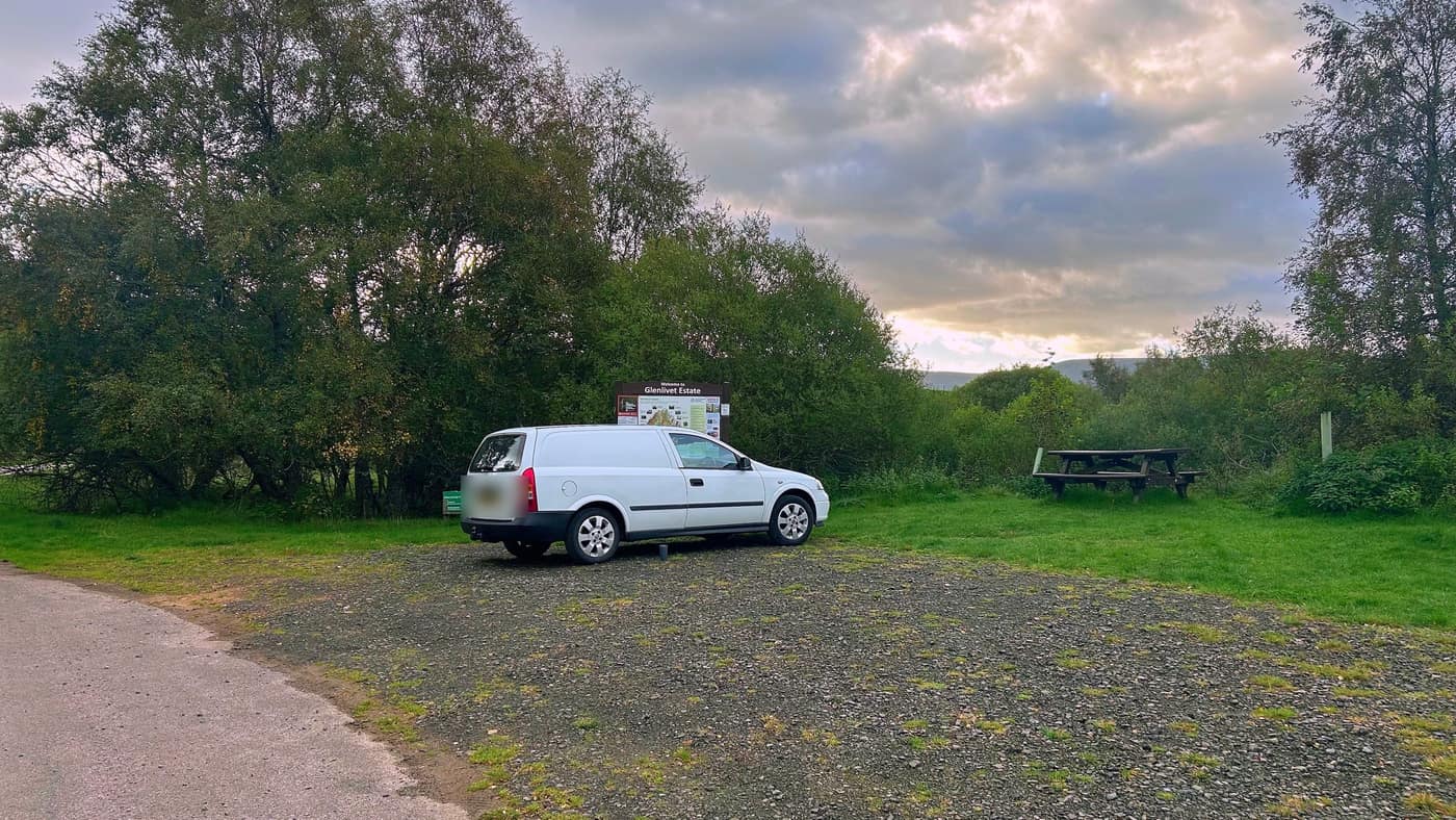 The Glenlivet Estate car park, with the estate board and a picnic
bench