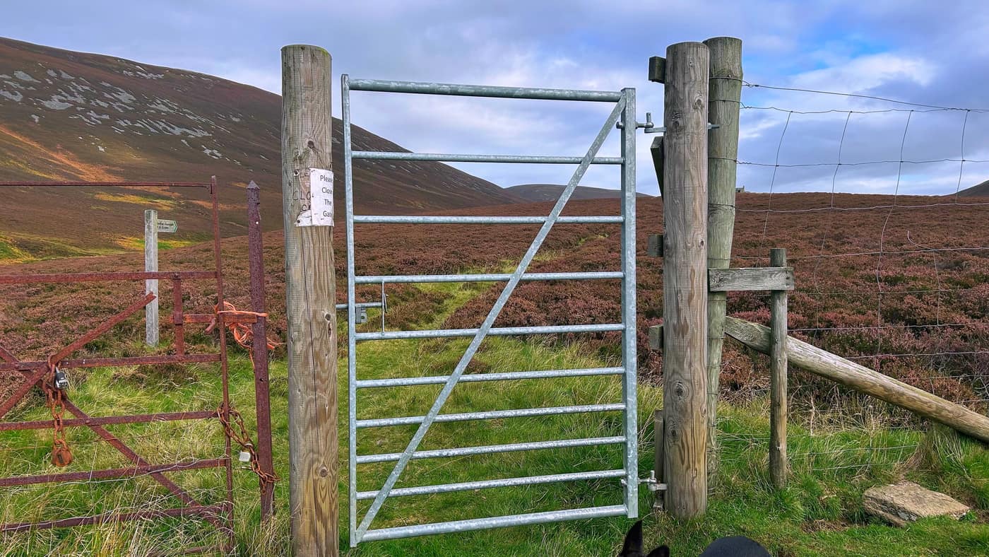 The gate at the foot of the climb, a hand-written Please Close The Gate note on the post