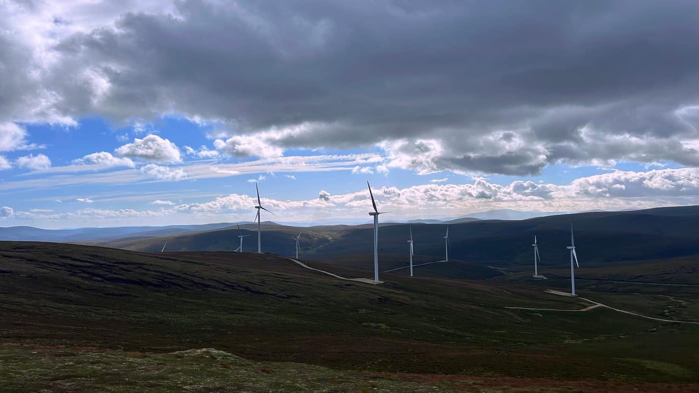 The whole wind farm spread over the moor, its roads winding through the heather