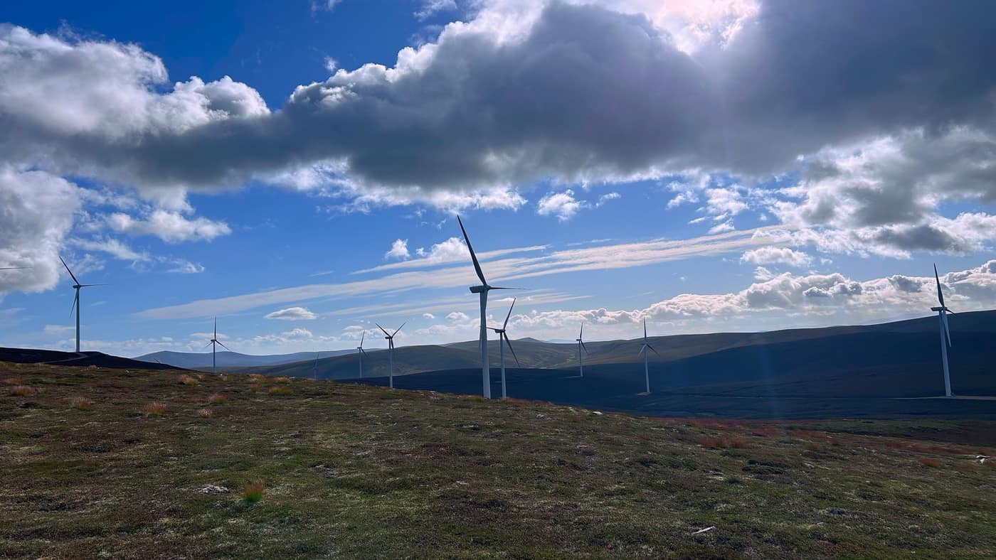 The windmills right beside the path now, the sun in behind the cloud