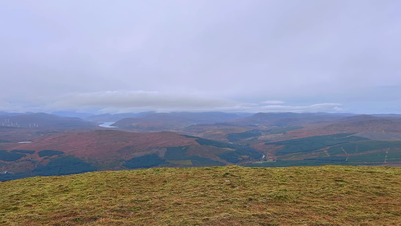 The view west from the summit, a long loch running up the glen