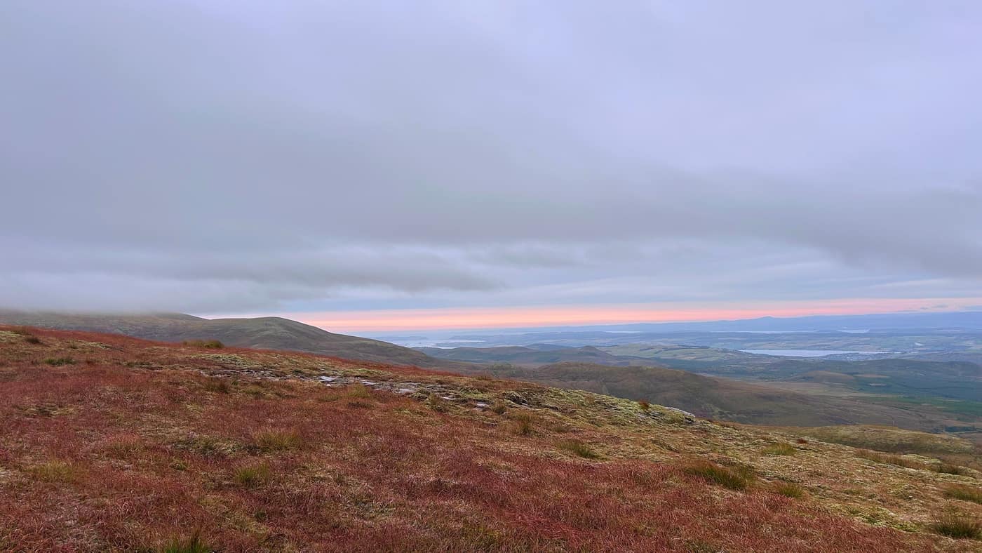A strip of pink sky over the firths to the east