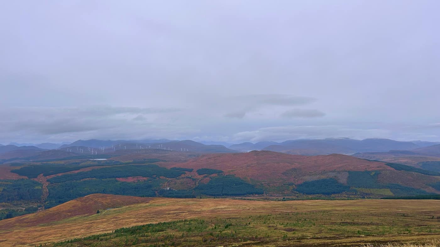 The windmills along the hills, cloud on the tops behind