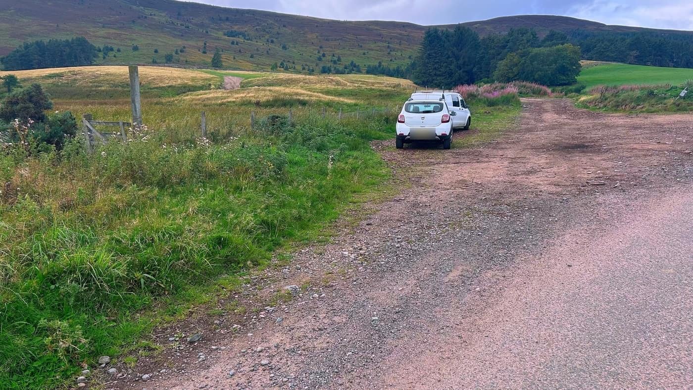The parking spot off the track, with the hill behind it