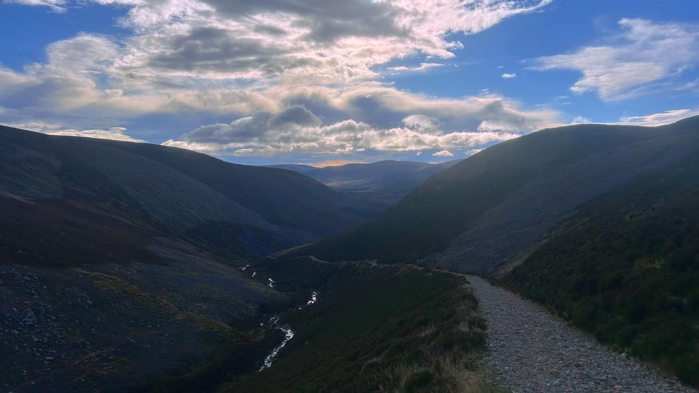 Looking back from higher up, the burn below and the glen running away behind