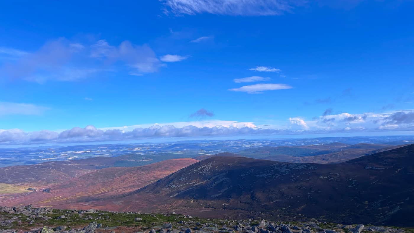Looking out over the lowlands from the top, blue sky above