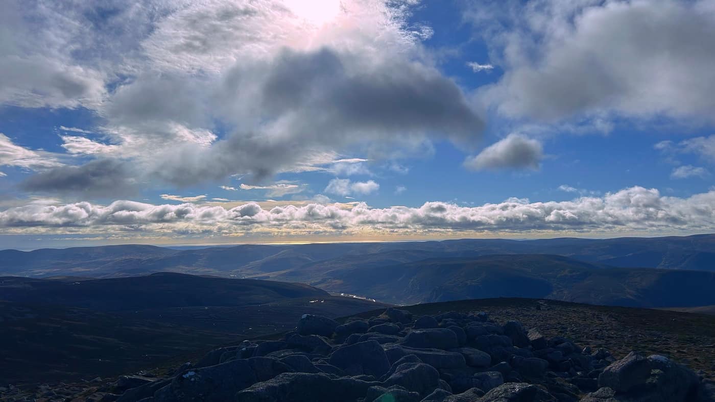 The summit boulders and the glens running away below