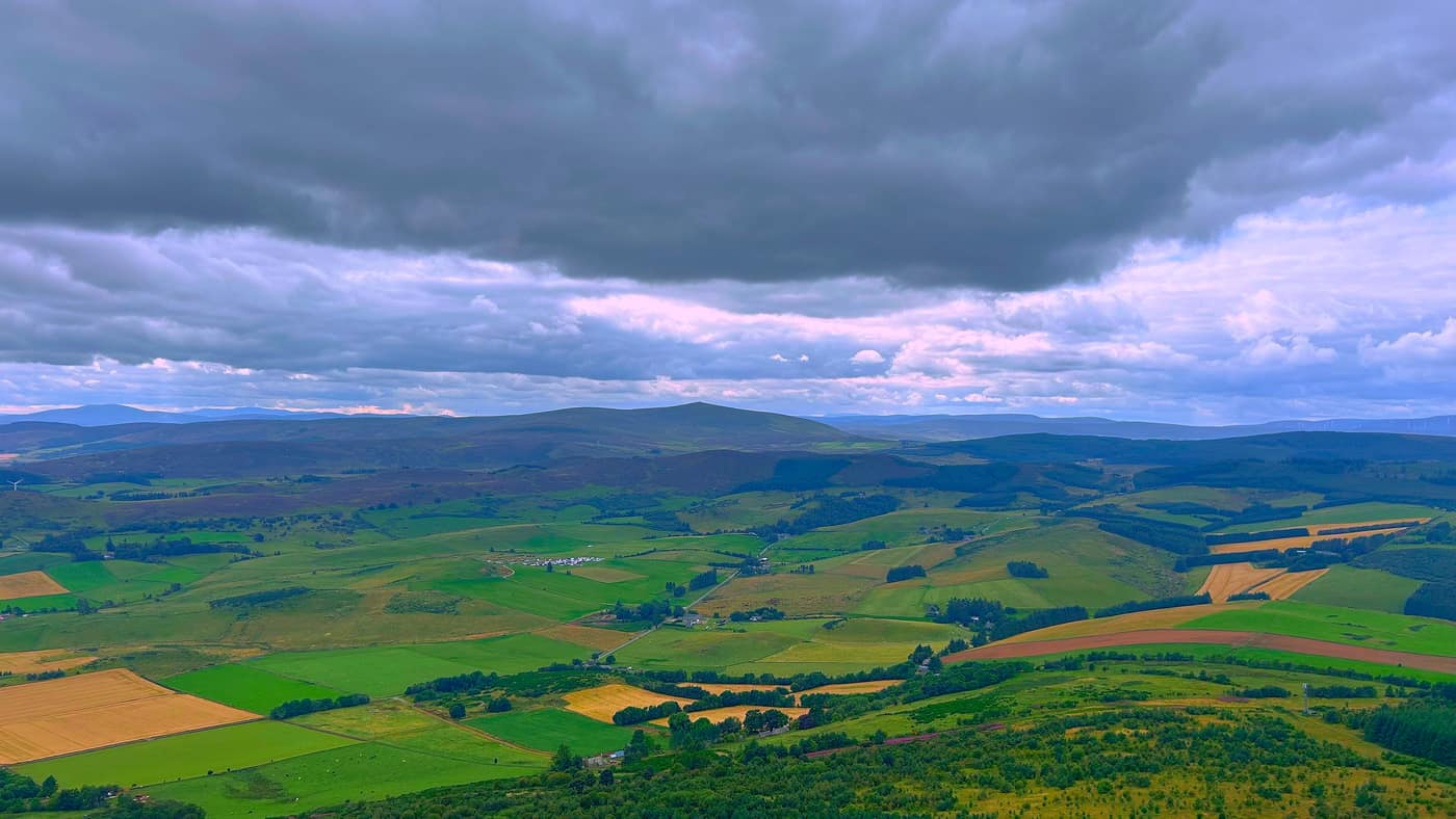 Farmland and a peak sitting on the far skyline