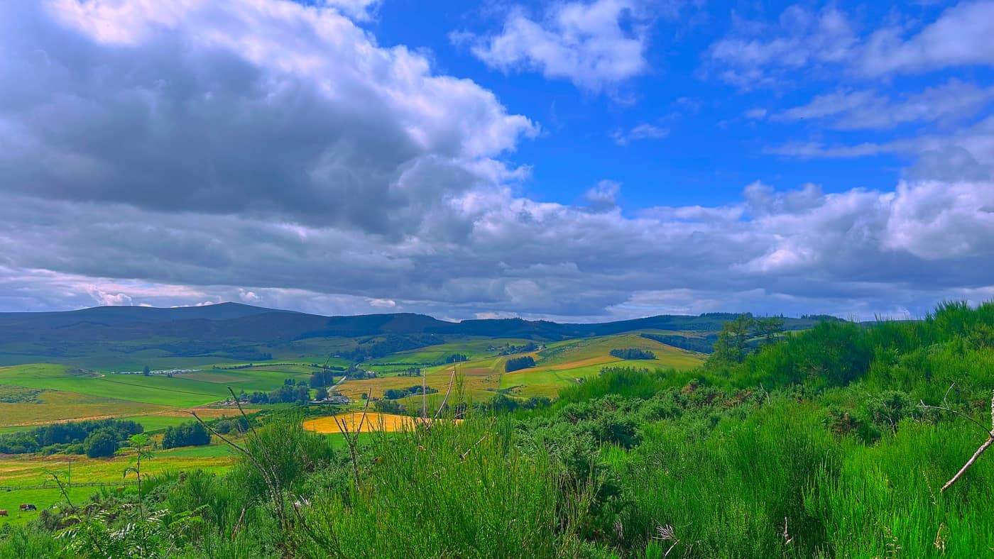 The view out over the fields and low hills from the path