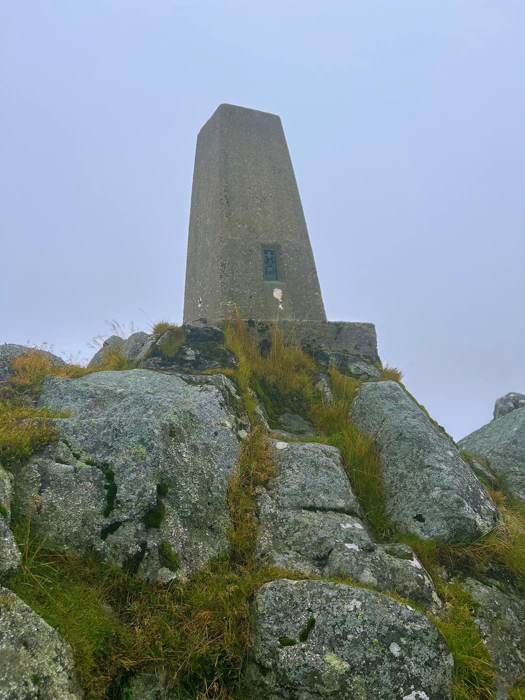 Looking up the granite at the trig pillar and its flush bracket